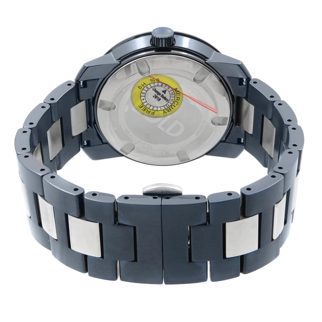 An image of a wristwatch taken from the back view, focusing on the closed clasp. The watch features a metal bracelet with alternating polished and matte links. The photograph is taken at a close angle, highlighting the details of the watch's back casing and bracelet. The watch is in new condition but has defects.