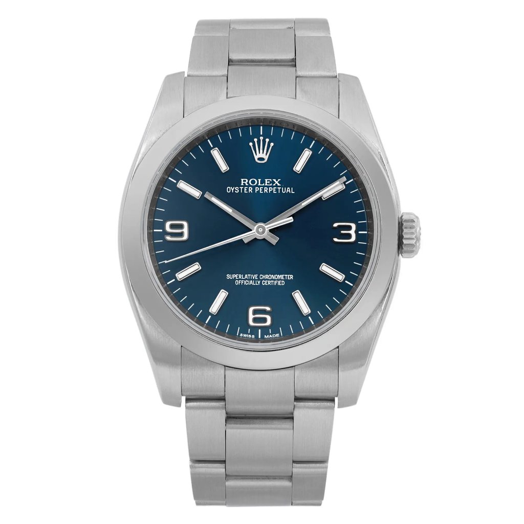 An image of a pre-owned wristwatch displayed from a front full frontal view. The watch features a silver metal band and a blue dial with silver hour markers and hands. The brand name is visible on the dial, and the watch is positioned centrally, showing its details clearly at a close distance.
