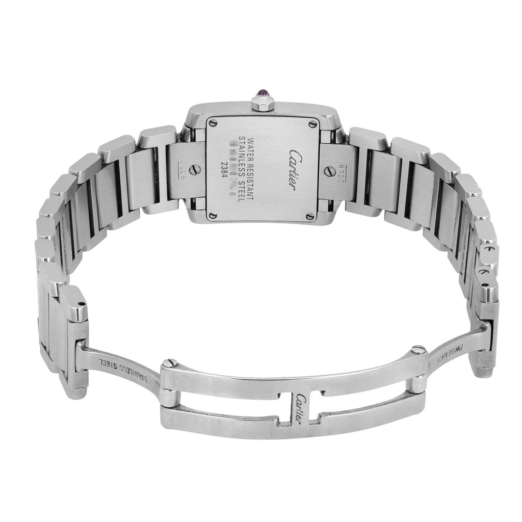 An image of a pre-owned women's Cartier wristwatch, viewed from the back at a slight overhead angle. The stainless steel bracelet is open, showing the watch's clasp and engraved details on the case back. The focus is on the back of the watch, highlighting its water-resistant properties and brand engraving, captured at a close distance.
