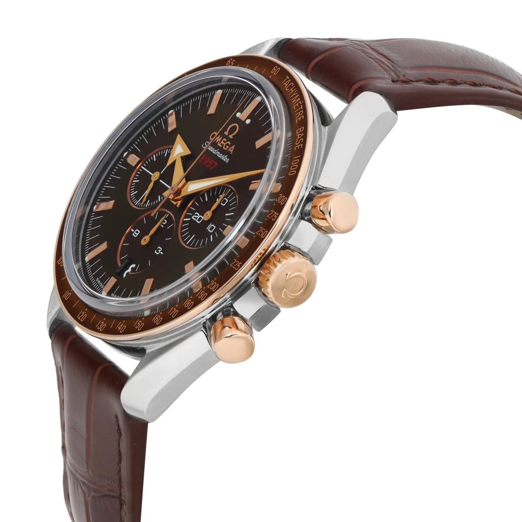 An image of a pre-owned wristwatch shown from a side profile view. The watch face is angled slightly upwards, prominently displaying the crown and pushers on the right side. The watch features a brown leather strap and a detailed black dial with multiple sub-dials. The bezel and crown are in contrasting gold tones, adding elegance to its design. The image captures the watch at a close distance, highlighting its intricate features and craftsmanship.
