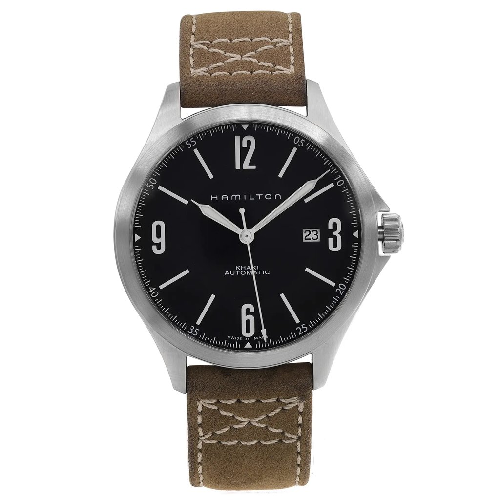 An image of a wristwatch taken from a front full frontal view. The watch features a black dial with white numerals and hands, including a date display at the 3 o'clock position. The stainless steel case has a polished finish, and the timepiece is paired with a brown leather strap with visible stitching. The image is a close-up, showcasing the watch as a display model.