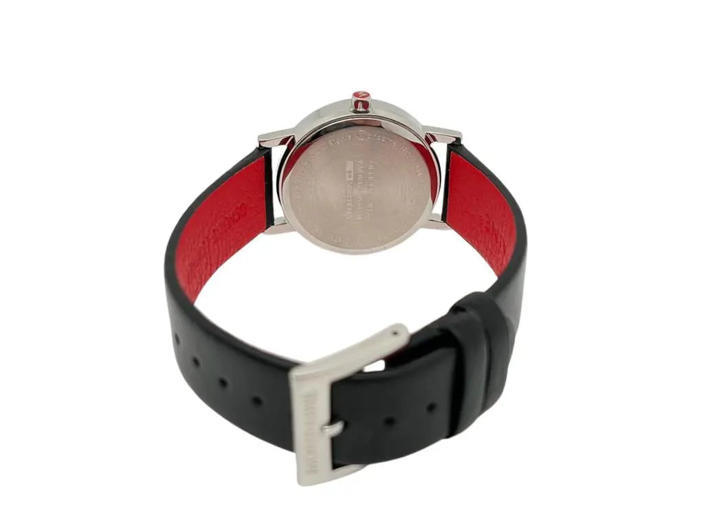 An image of a Wristwatch by Mondaine. This Display Model item is designed for Women, featuring a Casual style. It has a Quartz movement and an Analog display with a White dial color. The indices include 12-Hour Dial,Non-Numeric Hour Marks,Stick Indexes. The band is made of Leather and the case is made of Stainless Steel. The watch has a Round shape with a case size of 30 mm and a case thickness of 7 mm.