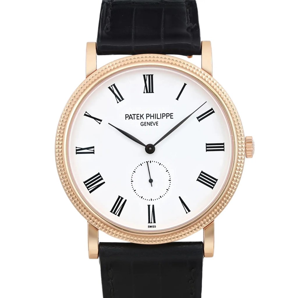 An image of a pre-owned wristwatch showing a close-up, front view of the watch face. The watch features a white dial with black Roman numerals and a small subdial. The case is gold-toned with a textured bezel, and it is attached to a black leather strap. The brand name is visible on the upper portion of the face.