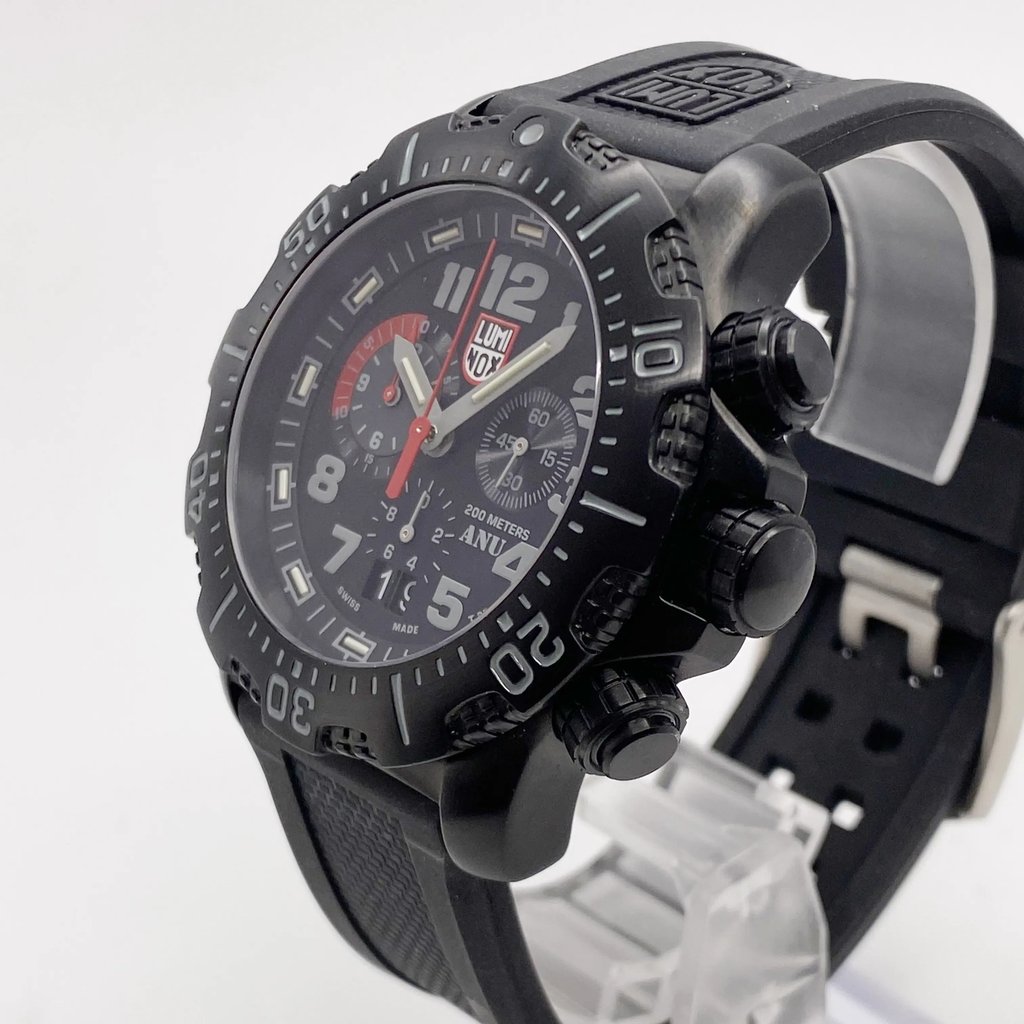 An image of a Wristwatch by Luminox. This Display Model item is designed for Men, featuring a Casual style. It has a Quartz movement and an Analog display with a Black dial color. The indices include 12-Hour Dial,Arabic Numerals. The band is made of Rubber and the case is made of Stainless Steel. The watch has a Round shape with a case size of 45 mm and a case thickness of 13 mm.