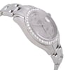 An image of a pre-owned wristwatch captured from a side profile view opposite the crown. The watch features a polished metal bracelet and a round face adorned with a diamond-set bezel. The angle highlights the watch's sleek design and craftsmanship, with the face and bracelet subtly curving in the image. The image is taken from a close distance, emphasizing the details and texture of the materials.