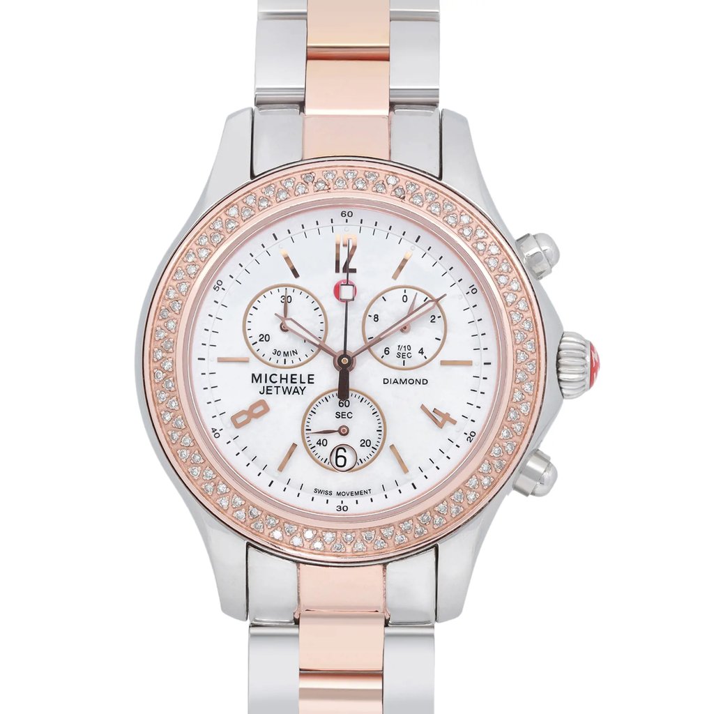 An image of a pre-owned wristwatch, shown in a front close-up shot of the watch face. The watch features a round dial with three subdials and a date window at the 6 o'clock position. The bezel is adorned with small diamonds, and the watch has a two-tone metal strap in silver and rose gold hues. The branding "Michele Jetway" is visible on the dial.