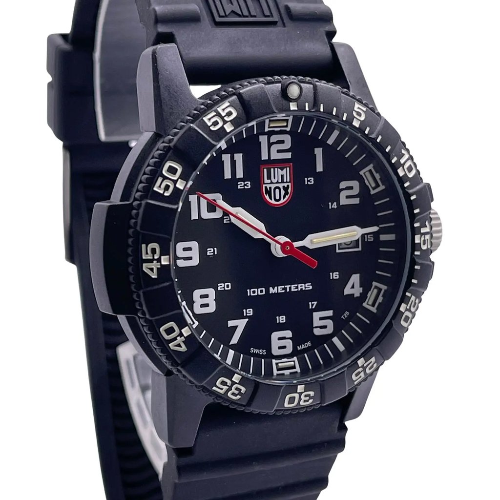 An image of a Wristwatch by Luminox. This Pre Owned item is designed for Men, featuring a Casual,Military style. It has a Quartz movement and an Analog display with a Black dial color. The indices include 12-Hour Dial,Arabic Numerals,Easy to Read/Large Numerals. The band is made of Rubber and the case is made of Carbonox. The watch has a Round shape with a case size of 44 mm and a case thickness of 13 mm.
