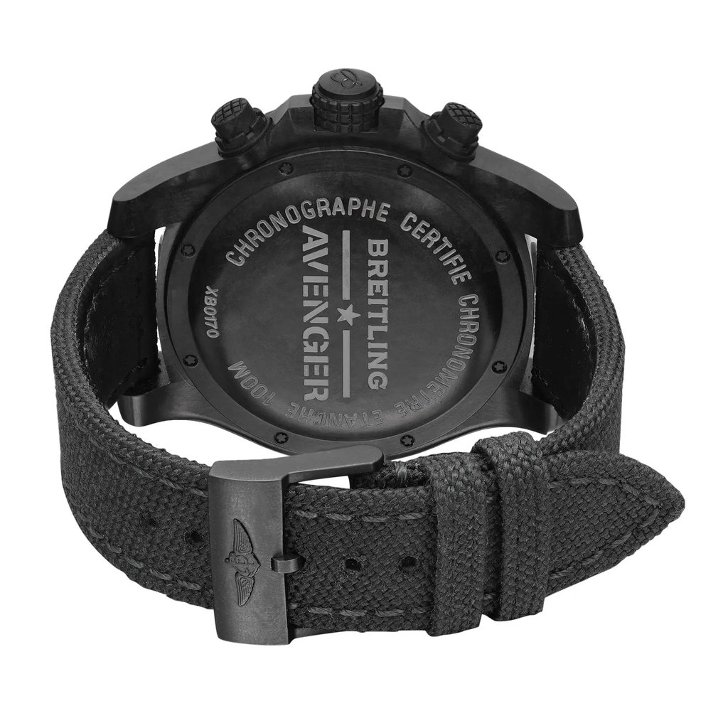 An image of a wristwatch taken from the back view, showcasing the closed clasp. The watch is positioned upright, with a close-up angle that highlights the detailed engravings on the back case and the textured strap. The watch is a display model, with the clasp prominently featuring a logo.