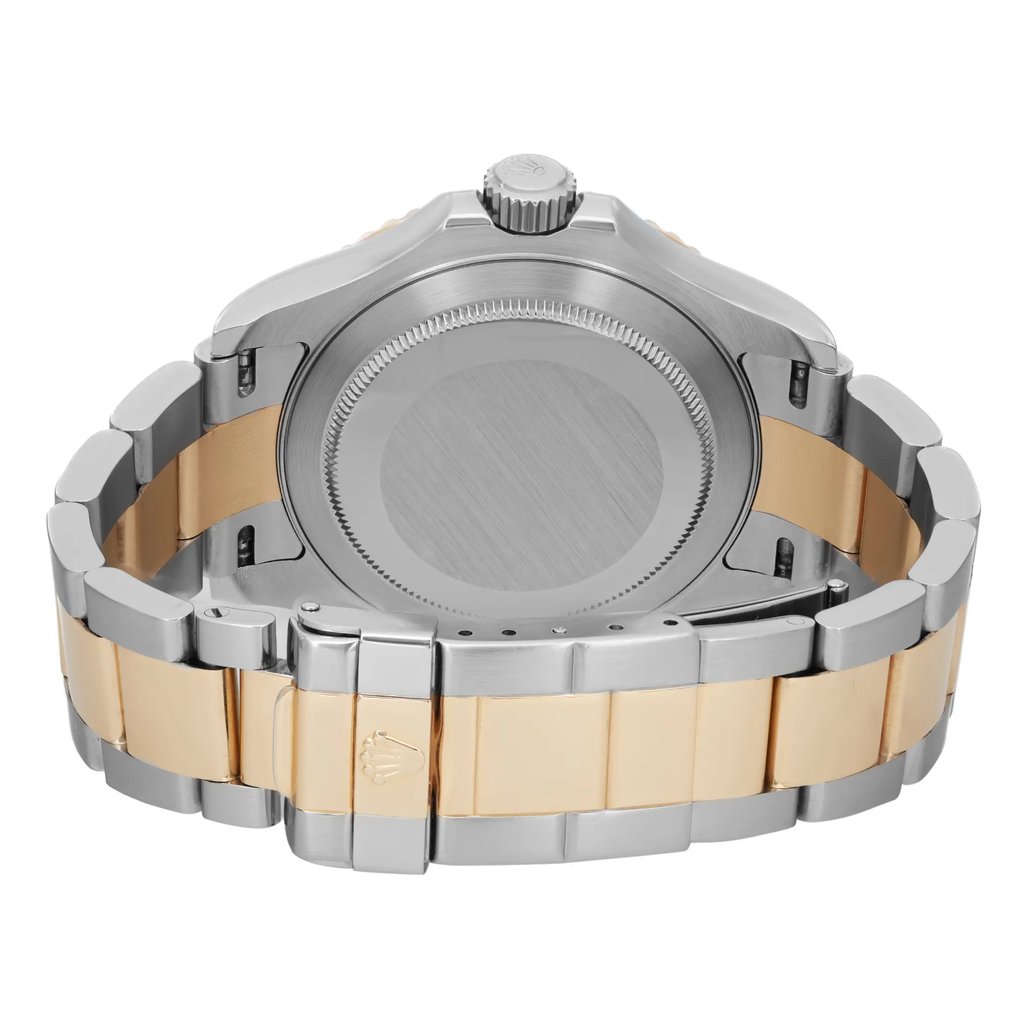 An image of a pre-owned wristwatch showing the back view with a closed clasp. The watch features a two-tone metal bracelet in silver and gold. The image is taken from a close angle, focusing on the case back, crown, and the clasp, which displays a logo.