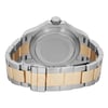 An image of a pre-owned wristwatch showing the back view with a closed clasp. The watch features a two-tone metal bracelet in silver and gold. The image is taken from a close angle, focusing on the case back, crown, and the clasp, which displays a logo.