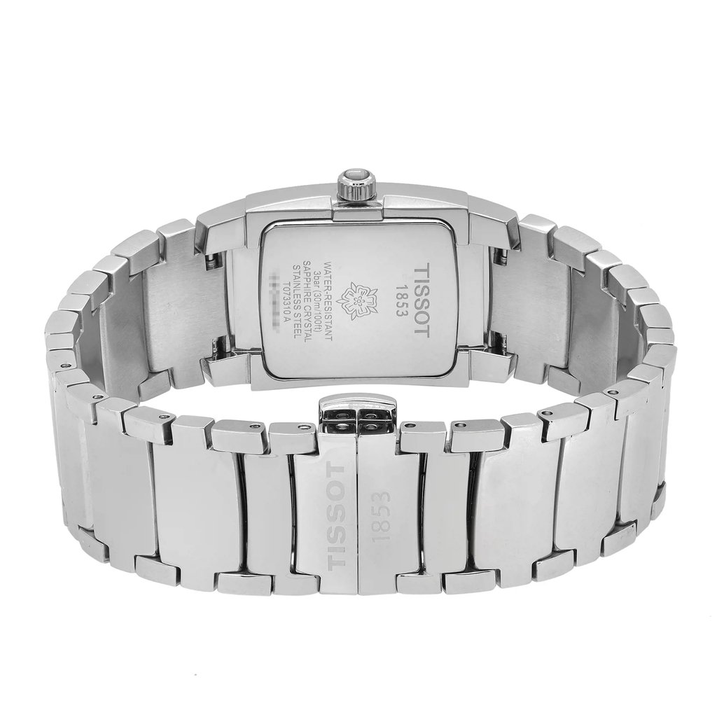 An image of a Tissot wristwatch, viewed from the back at a direct angle, showcasing the stainless steel case back and bracelet. The watch is positioned horizontally in the center with the bracelet slightly curved, and the image is taken from a close distance, emphasizing the engravings and brand markings on the metal surface. Display model in excellent condition. 