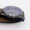 View of opposite crown facing side of the stainless steel case with a dents and scratches on it