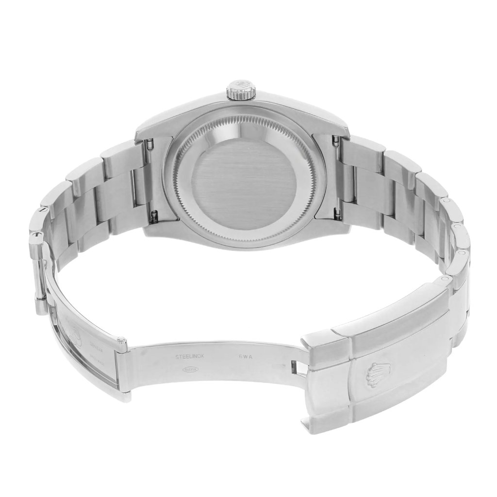 An image of a pre-owned wristwatch shown from the back view with the clasp open. The watch is positioned centrally, highlighting the stainless steel bracelet and the back of the watch case. The image is taken from a straight angle at a moderate distance, clearly displaying the details of the watch's construction and clasp mechanism.