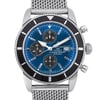 An image of a pre-owned Breitling men's wristwatch with a close-up front view focusing on the watch face. The watch features a round stainless steel case and a matching band, styled in a casual manner. It has a sunburst blue dial with gray stick indexes for the hours and a date indicator at the 3 o'clock position. Three subdials for the chronograph function are visible, and the hands are luminous. A black bezel with visible scratches on the insert surrounds the dial, and the watch has minor nicks on the case and case back. The angle of the photo is head-on, capturing the entire front of the watch with the band partially visible, and is taken from a close distance to show detail. The watch is in fair condition.