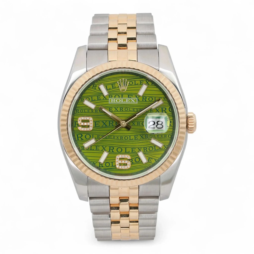 An image of a pre-owned unisex Rolex Datejust 36 Yellow Gold Steel Green Wave Diamond Dial Watch 116233, viewed from the front at a close distance. The watch features a green dial with "Rolex" text pattern, luminous hands, and a date indicator positioned at 3 o'clock. The bezel is yellow gold, complementing the two-tone gold and stainless steel bracelet.Comes with original box and papers. 2015 card. It shows light signs of wear. Recently serviced. The movement is calibrated and keeps time well.

