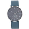 An image of a Skagen men's wristwatch, shown from a front-facing angle at a close distance. The watch features a minimalist design with a dark gray dial and a small seconds subdial. The hour markers are sleek and understated. It has a blue leather strap and a simple silver-toned bezel, accentuating its modern aesthetic.