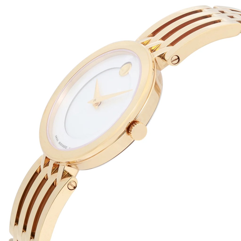 An image of a pre-owned wristwatch in a side profile view, showcasing the crown prominently. The watch features a gold-toned case and bracelet with a minimalist design. The angle highlights the sleek, polished finish and the simplicity of the watch face, which has a single dot marker and slim hands. The bracelet is elegantly linked, complementing the watch's refined appearance.