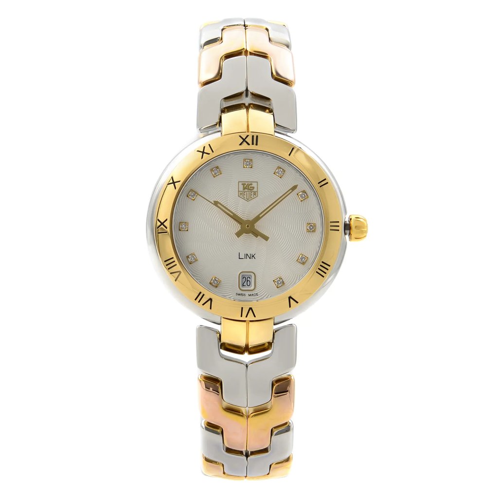 An image of a Wristwatch by TAG Heuer. This Pre Owned item is designed for Women, featuring a Dress/Formal,Luxury style. It has a Quartz movement and an Analog display with a Silver Guilloche dial color. The indices include 12-Hour Dial,Arabic Numerals. The band is made of Stainless Steel,Gold and the case is made of Stainless Steel. The watch has a Round shape with a case size of 34 mm and a case thickness of 10 mm.