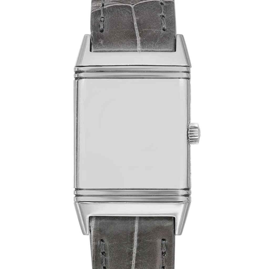 An image of a pre-owned wristwatch viewed from the front in a close-up shot. The watch face is rectangular and silver with a plain design, featuring a crown on the right side. The strap is made of dark leather with visible stitching. The angle captures the watch directly from the front, highlighting its minimalist aesthetic.