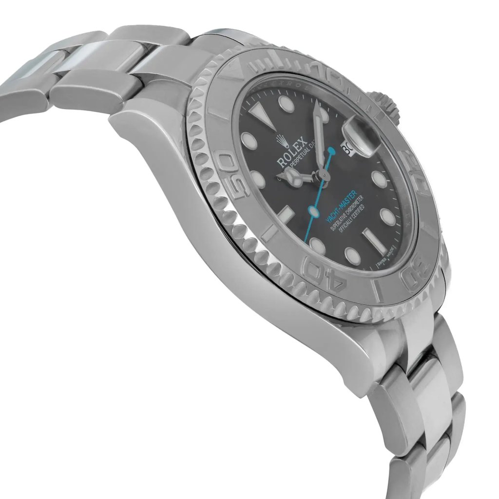 An image of a pre-owned wristwatch viewed from a side profile, opposite the crown. The watch features a metallic band and a detailed bezel, with the face showing hour markers and hands. The angle highlights the thickness of the watch, providing a close-up view of the design and craftsmanship.