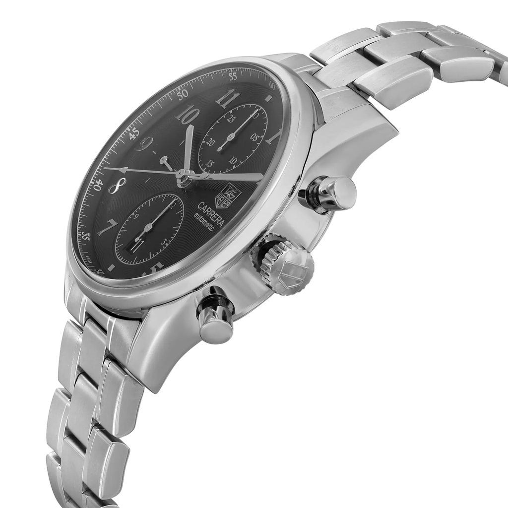 An image of a pre-owned TAG Heuer men's wristwatch in a casual style, taken from a side profile view showcasing the crown. The watch features a black dial with a gray bezel, a round stainless steel case, and a stainless steel band. It includes a chronograph, date indicator, and a small seconds subdial. The watch is positioned at an angle that highlights its side, with the face partially visible and the wristband curving away into the background. The distance from the camera gives a clear view of the watch's details without distortion.