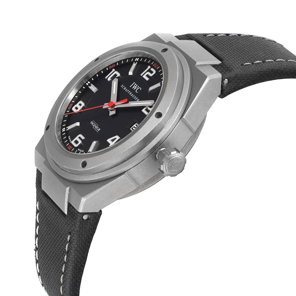 An image of a pre-owned wristwatch viewed from the side profile, showcasing the crown prominently. The angle highlights the watch's detailed case and design, with the face slightly tilted upwards. The distance allows for a clear view of the watch's features, including the textured strap and bold dial elements.