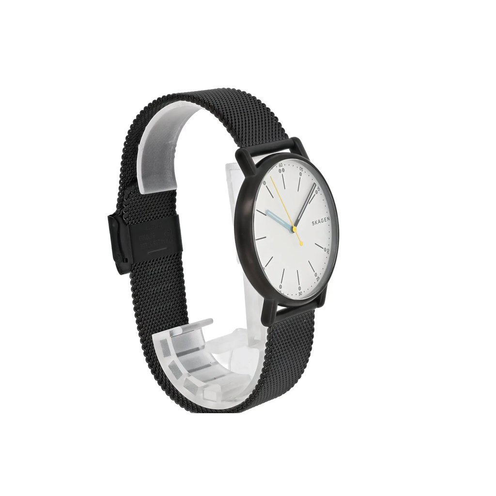 An image of a Skagen women's wristwatch displayed at a three-quarter angle. The watch features a black mesh band and a round, minimalist white dial with thin black hour markers. The hands are a contrasting light blue and yellow. The watch is positioned on a transparent stand against a white background, showcasing its sleek and modern design.