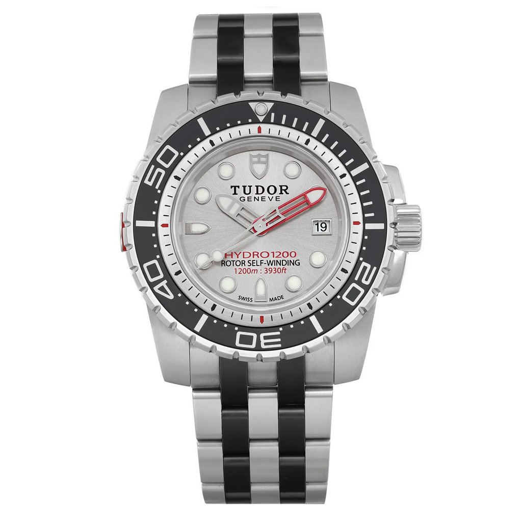 An image of a wristwatch shown from a front full-frontal view. The watch features a silver and black design with a prominent bezel and a metal strap. The face displays the brand name and various markings, including a date window on the right side. The image is taken at a close distance, highlighting the details and craftsmanship of the watch.