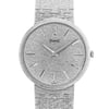 An image of a pre-owned Piaget unisex wristwatch. The watch is positioned upright, displaying its textured silver dial and matching bracelet. The watch face is viewed from the front at a close distance, highlighting the minimalist design with slender hour markers and hands. The textured bracelet seamlessly complements the dial, showcasing a cohesive aesthetic.