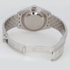 Back View Of Solid Back Case And Open Stainless Steel Band Of Rolex 126300 Watch Pre Owned Condition