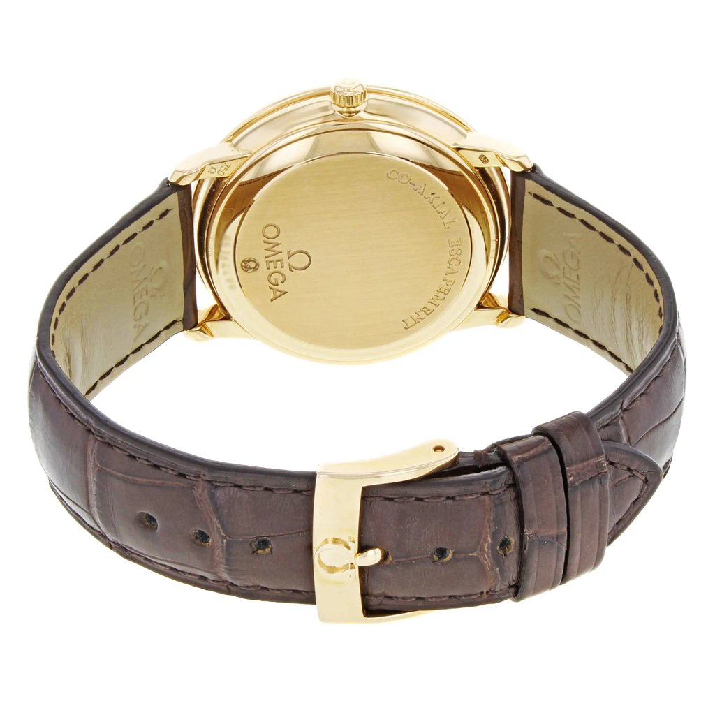 An image of a men's OMEGA wristwatch taken from the rear, showcasing the rose gold case and clasp. The watch is positioned upright with the back facing the viewer, displaying the brand's engravings. The angle captures the entire watch, including the brown leather strap, from a medium distance, highlighting its design as a display model.