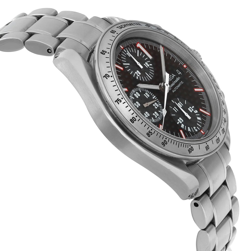 An image of a pre-owned OMEGA men's sport wristwatch, viewed from a side profile opposite the crown. The watch features a round stainless steel case and band with a gray bezel. It has a black dial with a carbon fiber pattern, chronograph functions, a date indicator, luminous hands, and a small seconds subdial. The image is taken from a close distance, capturing the watch at an angle that highlights the side contour and the curvature of the band. The condition shows signs of wear, including water damage on the hands.