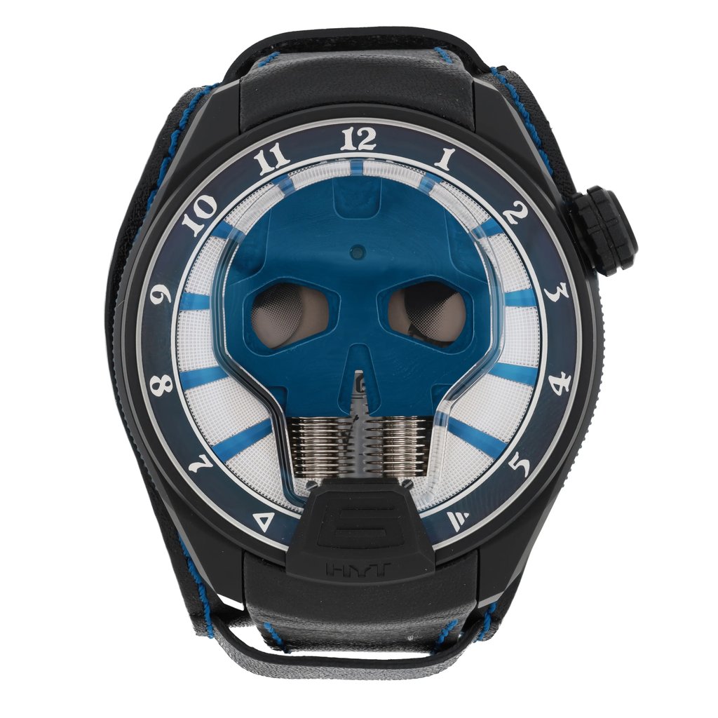 An image of a pre-owned HYT Skull AXL Guns N Roses 51mm Titanium PVD men's wristwatch, captured from a top-down angle. The watch face features a distinctive blue skull design with a fluidic time display. The numerals are arranged around the edge, and the watch has a black strap with blue stitching. The image is taken at a close distance, highlighting the intricate details of the watch's design.