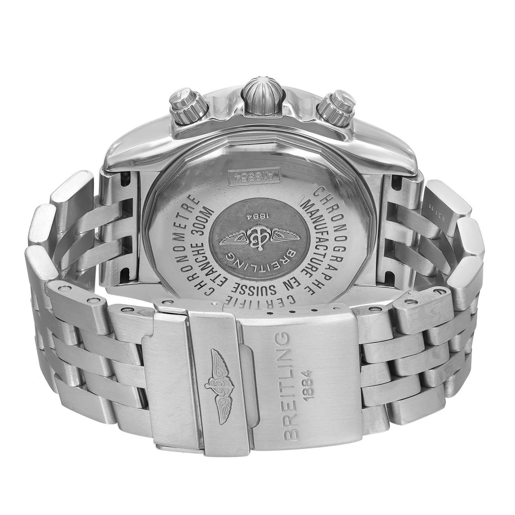 An image of a pre-owned men's Breitling wristwatch, taken from a close-up back view showcasing the screwback caseback and stainless steel fold-over clasp with flip lock safety. The watch is positioned so that the back of the case is visible center frame, with the stainless steel band partially open and extending to the sides. The round shape of the case is evident, and the engravings on the caseback detail the brand and water-resistance information. The image is taken at a distance that captures the entire back of the watch and the clasp mechanism clearly, with a straight-on angle that allows for easy viewing of the details. The case back and bracelet shows signs of wear.