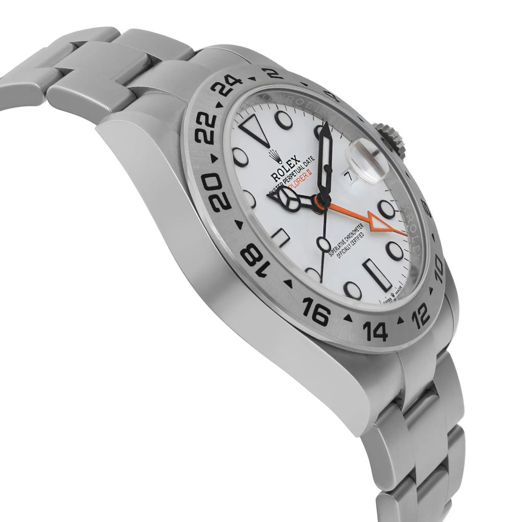 An image of a pre-owned wristwatch viewed from the side profile, opposite the crown. The watch features a stainless steel band and a bezel marked with 24-hour indicators. The face is white with black indices and includes a date magnification window. The angle highlights the thickness and curvature of the watch, with a close-up perspective emphasizing the design details.