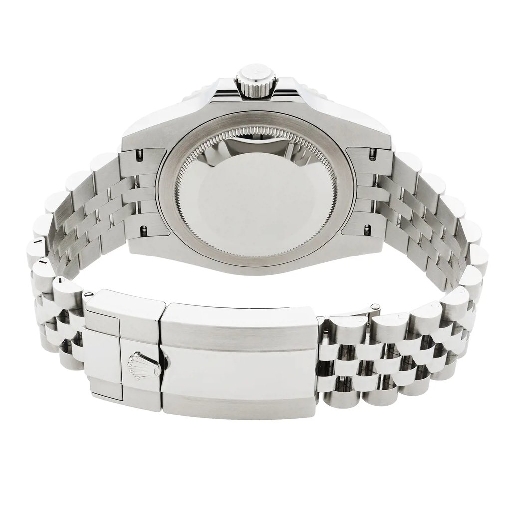 An image of a Wristwatch by Rolex. This Pre Owned item is designed for Men, featuring a Luxury style. It has a Mechanical (Automatic) movement and an Analog display with a Black dial color. The indices include 12-Hour Dial,Non-Numeric Hour Marks. The band is made of Stainless Steel and the case is made of Stainless Steel. The watch has a Round shape with a case size of 40 mm and a case thickness of 12 mm.