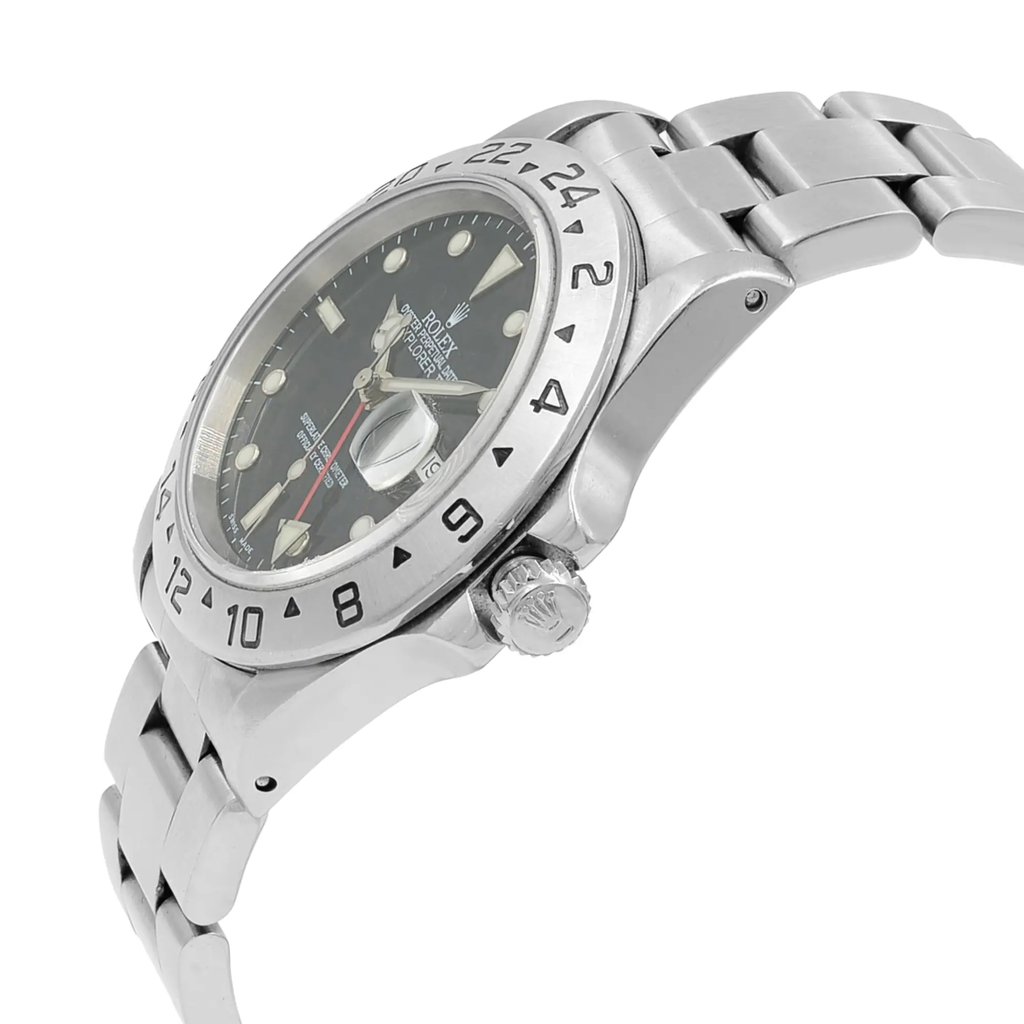 An image of a pre-owned wristwatch in a side profile view, displaying the crown. The watch is angled slightly upward, revealing the dial with clear hour markers and the brand's logo. The metal bracelet is partially visible, showcasing its polished finish. The watch is positioned at a mid-range distance, allowing for detailed observation of its features.