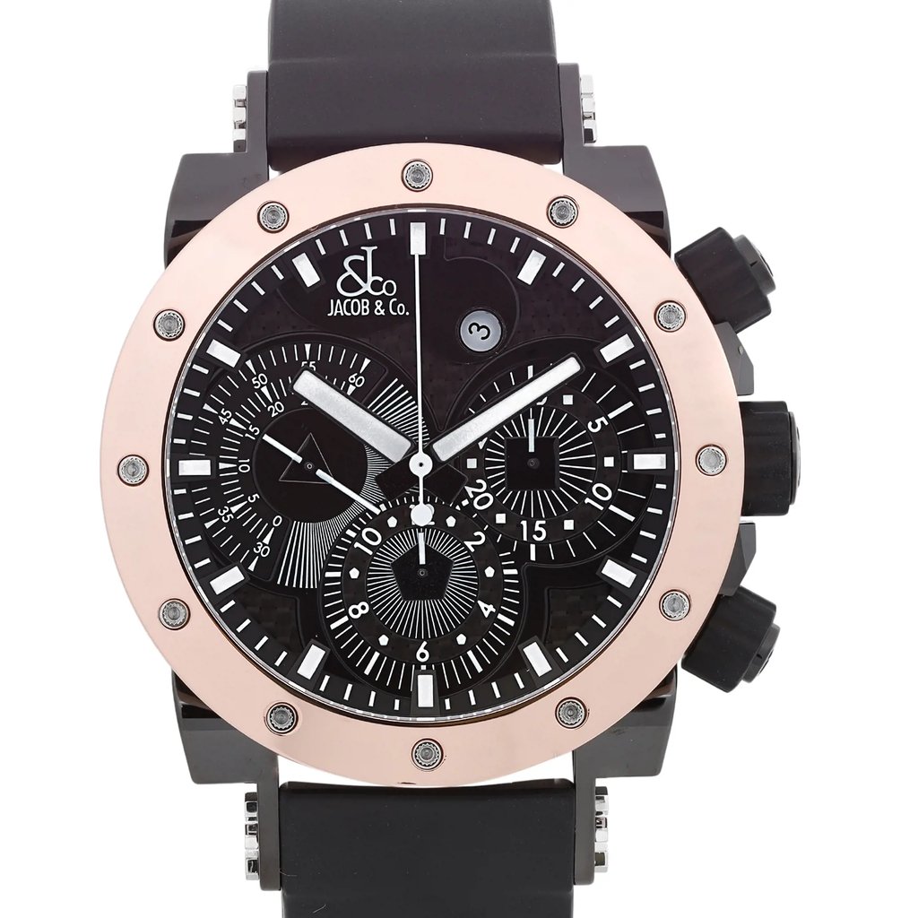 An image of a Wristwatch by JACOB & Co.. This Pre Owned item is designed for Men, featuring a Luxury style. It has a Mechanical (Automatic) movement and an Analog display with a Black dial color. The indices include 12-Hour Dial,Stick Indexes. The band is made of Rubber and the case is made of Rose Gold. The watch has a Round shape with a case size of 47 mm and a case thickness of 17 mm.