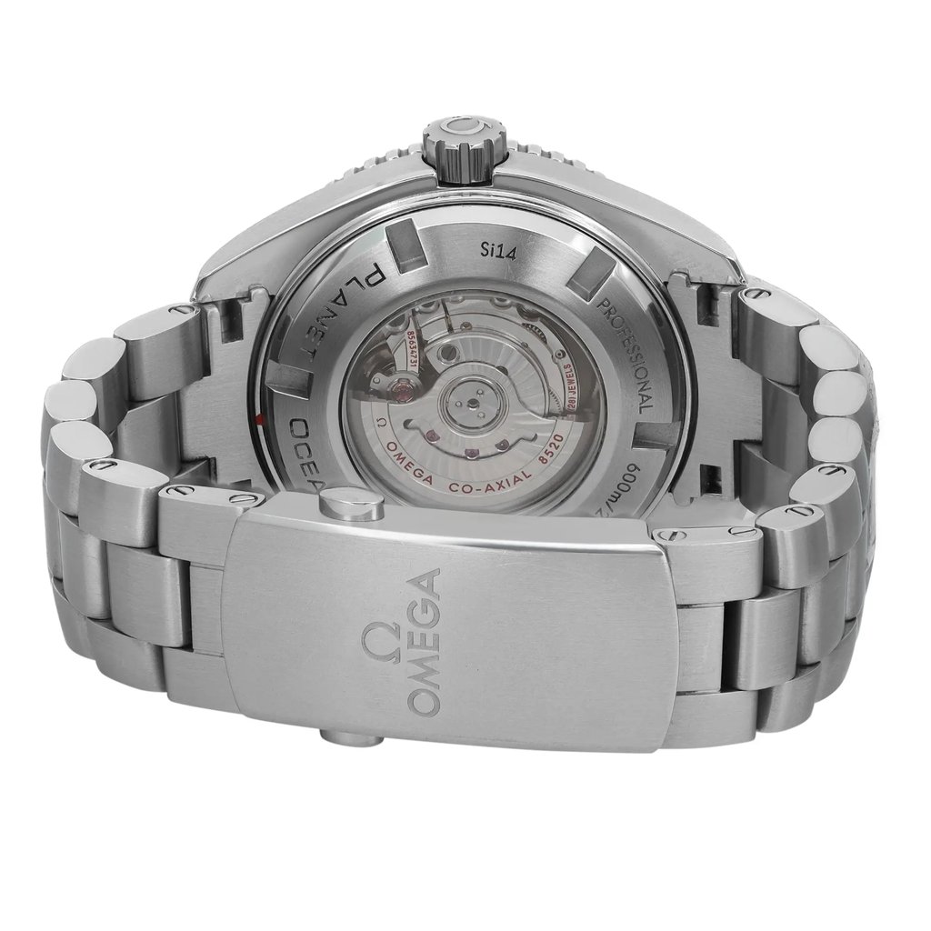 An image of a pre-owned women's OMEGA wristwatch, showcasing the back view at a close angle. The stainless steel band is visible, featuring a fold-over clasp with a double push button. The round case has an exhibition caseback, revealing the watch's inner mechanism. The clasp displays the OMEGA logo.