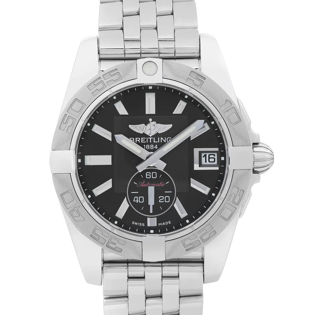 An image of a display model Breitling wristwatch, with a clear front close-up view of the watch face. The luxury unisex watch features a round black dial with stick indexes and a 12-hour dial format, framed by a gray bezel. The date is visible at the 3 o'clock position. It has a stainless steel band and case, and the watch is positioned upright at a direct angle to the camera, offering a full, detailed view of its excellent condition. The watch is a display model and it may show minor blemishes due to store handling.