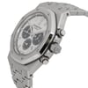 An image of a pre-owned men's Audemars Piguet wristwatch taken at a slight angle, showcasing the watch face and part of the bracelet. The watch features luminous hands and a sophisticated design with a stainless steel case. The close-up shot highlights the intricate details of the dial and the brand's logo, with the side buttons and crown visible on the right.