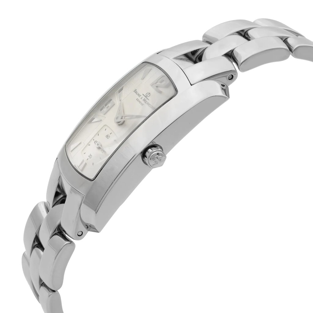 An image of a pre-owned wristwatch viewed from the side profile, showcasing the crown prominently. The watch features a sleek metal bracelet and a rectangular face with visible markings. The angle highlights the curvature of the watch case and the polished links of the bracelet, with the crown positioned centrally in the image. The photograph is taken at a close distance, emphasizing the watch's details and craftsmanship.