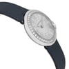 An image of a pre-owned Cartier women's wristwatch, shown from a side angle. The watch face is tilted slightly upward, highlighting its silver dial with Roman numerals and a bezel adorned with sparkling stones. The strap is dark-colored and the image is taken at a close distance, emphasizing the watch's elegant design and fine details.