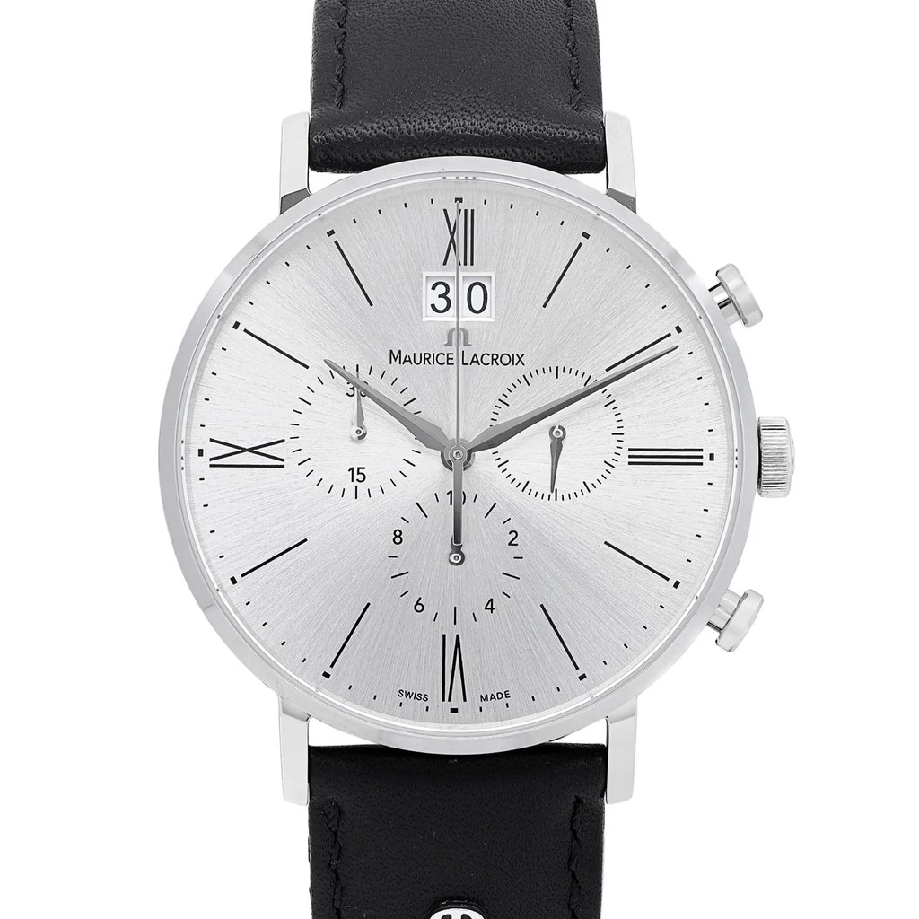 An image of a Wristwatch by Maurice Lacroix. This Unworn item is designed for Men, featuring a Casual style. It has a Quartz movement and an Analog display with a Silver dial color. The indices include 12-Hour Dial,Roman Numerals,Stick Indexes. The band is made of Leather and the case is made of Stainless Steel. The watch has a Round shape with a case size of 40 mm and a case thickness of 10 mm.