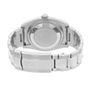 An image of a pre-owned wristwatch showcasing the back view with the clasp closed. The watch features a stainless steel band and a brushed metal case back. The angle is straight-on, capturing the watch from a close distance to highlight the details of the clasp and bracelet links.