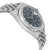 An image of a pre-owned wristwatch captured from a side profile view, opposite the crown. The watch features a metallic case and a linked bracelet. The angle highlights the texture and design of the bezel and the partially visible dial, with the camera positioned at a slight upward angle, providing a close-up perspective.