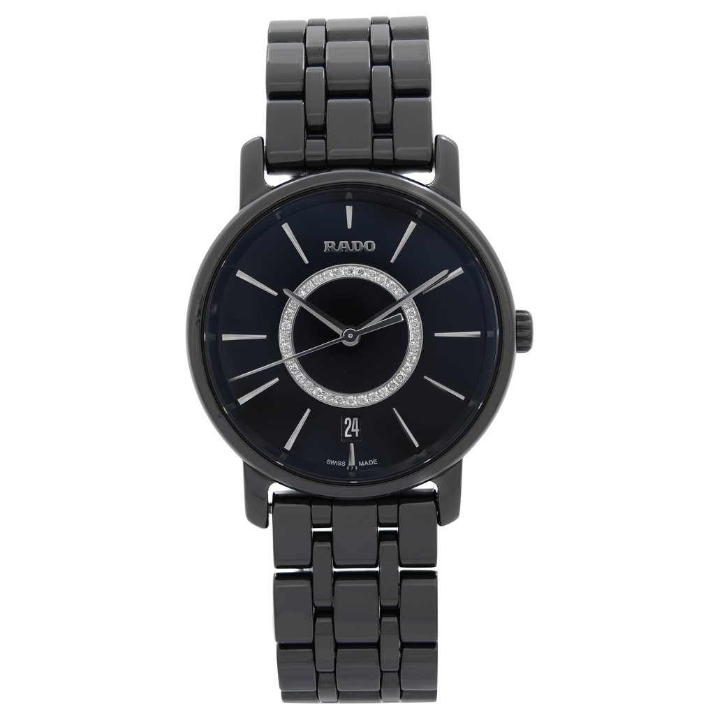 An image of a Wristwatch by Rado. This New With Defects item is designed for Women, featuring a Dress/Formal style. It has a Quartz movement and an Analog display with a Black dial color. The indices include 12-Hour Dial,Stick Indexes. The band is made of Ceramic and the case is made of Ceramic. The watch has a Round shape with a case size of 33 mm and a case thickness of 8 mm.