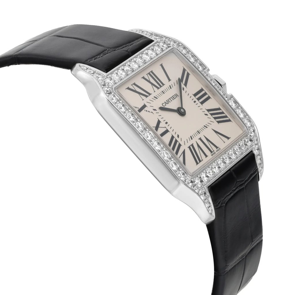 An image of a pre-owned wristwatch viewed from the side profile, opposite the crown. The watch features a rectangular face with Roman numerals and is bordered by a bezel adorned with small, sparkling stones. Its black leather strap is visible, and the angle highlights the sleek design and elegant details of the timepiece.