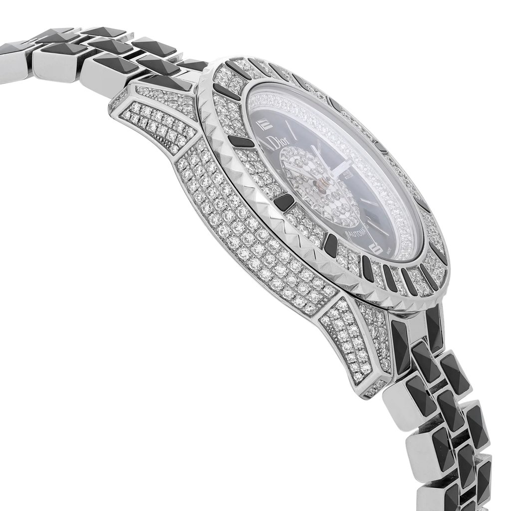 An image of a wristwatch in a side profile view, opposite the crown, showcasing its intricate design. The watch features a sparkling, diamond-encrusted bezel and strap, with a focus on the detailed craftsmanship. The angle highlights the watch's luxurious aesthetic, photographed at a close distance to emphasize the embellishments and texture. The condition is pristine, indicative of a display model.