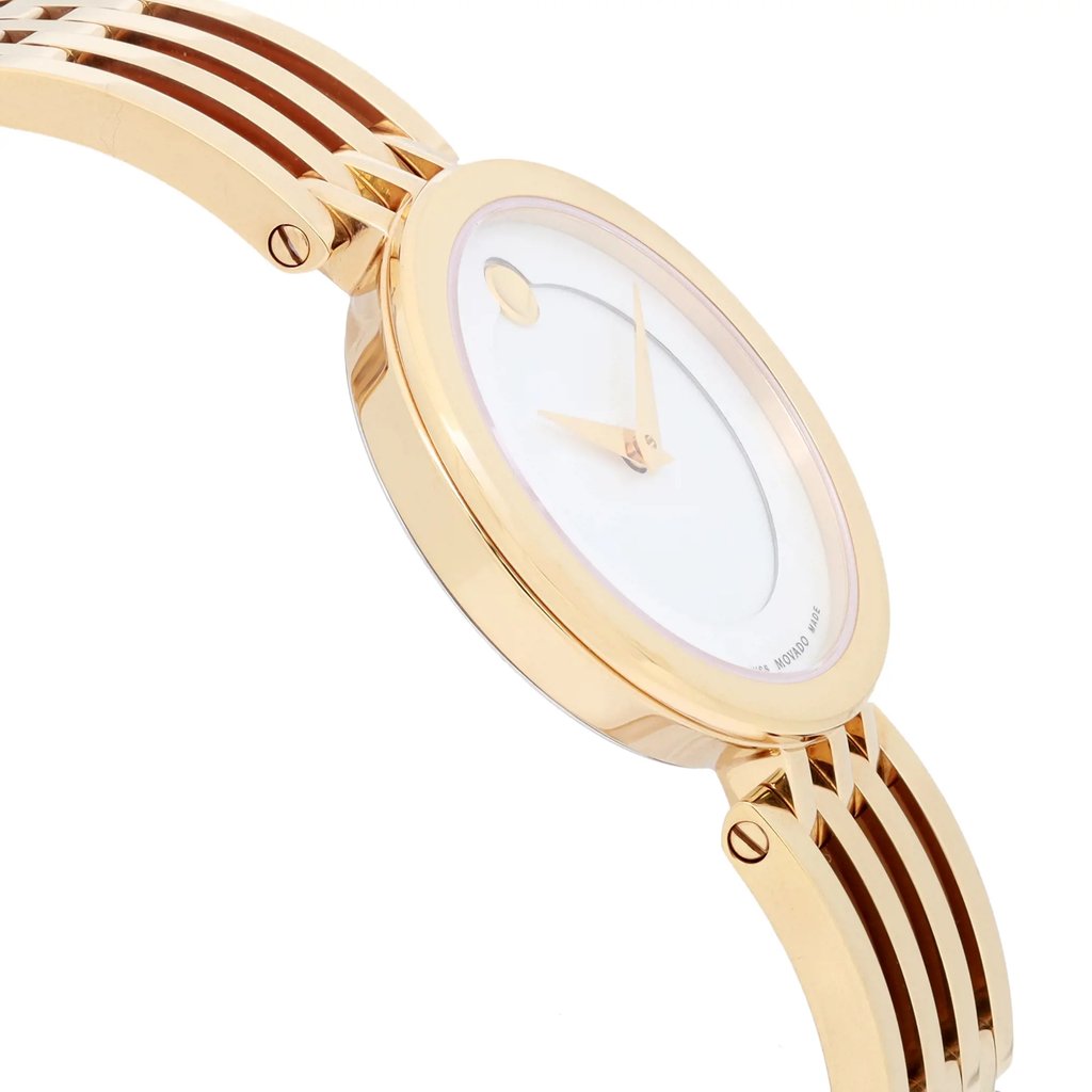An image of a pre-owned wristwatch taken from a side profile view, opposite the crown. The watch features a sleek, gold-toned case and a matching bracelet with a smooth, polished finish. The face is minimalist, with gold hands set against a light background. The watch is positioned at a slight angle, emphasizing the curvature and design of the bracelet links, captured from a close distance.